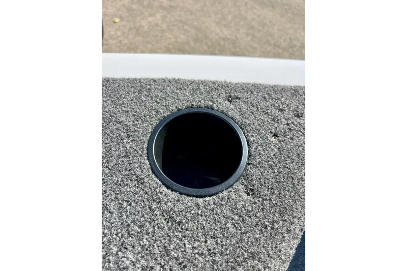 Slide: The Image of 2024 Crestliner 1650 Fish Hawk SC boat rod holder on carpeted deck. - 49