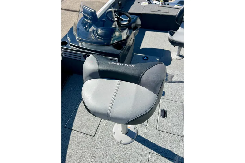 Slide: The Image of 2024 Crestliner 1650 Fish Hawk SC boat interior with comfortable seating and steering console. - 51
