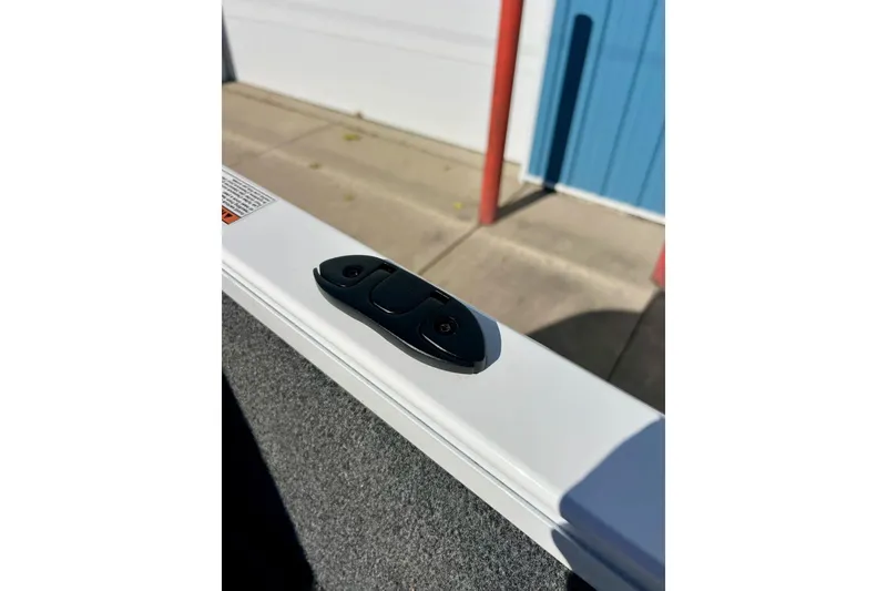 Slide: The Image of 2024 Crestliner 1650 Fish Hawk SC boat detail, featuring a cleat on the deck. - 56