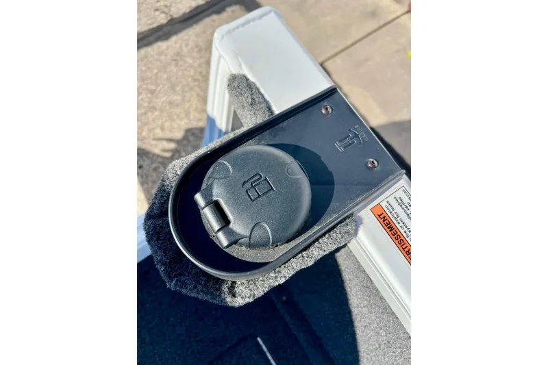 Slide: The Image of 2024 Crestliner 1650 Fish Hawk SC boat detail, featuring a black circular component. - 58