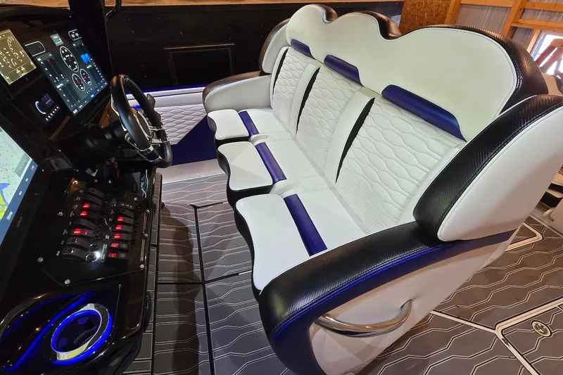 Slide: The Image of 2021 Sunsation 34 CCX cockpit with luxurious seating and advanced navigation controls. - 17