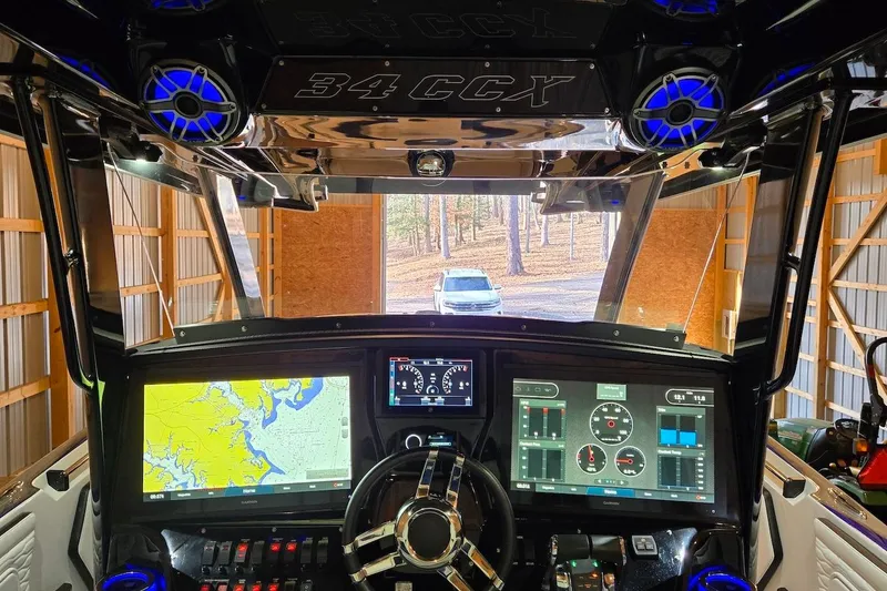 Slide: The Image of 2021 Sunsation 34 CCX boat cockpit with advanced navigation and control displays. - 20