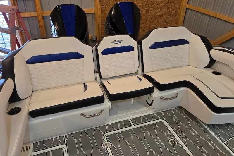 Slide: The Image of Luxurious seating on 2021 Sunsation 34 CCX boat with stylish white and blue upholstery. - 23