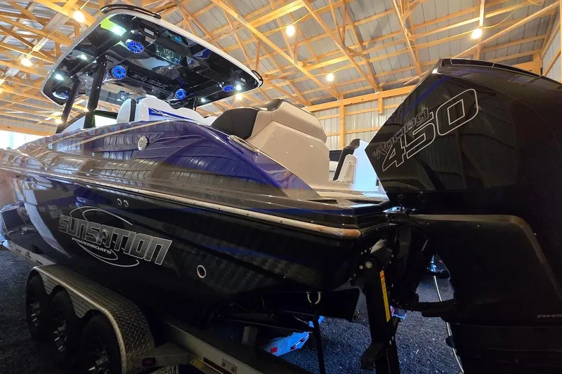 Slide: The Image of 2021 Sunsation 34 CCX powerboat with Racing 450 engine in a well-lit indoor setting. - 27
