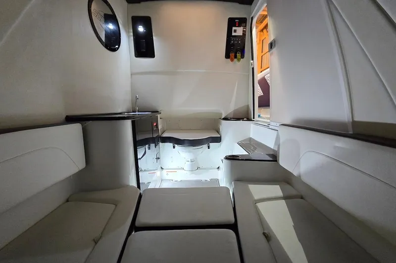 Slide: The Image of Interior of 2021 Sunsation 34 CCX boat, featuring sleek seating and modern amenities. - 35