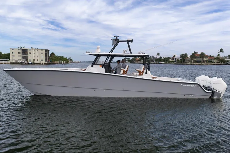 The Image of 2022 Freeman 42LR boat on water, featuring sleek design and powerful engines. - 1