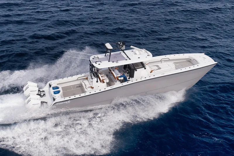 Slide: The Image of 2022 Freeman 42LR boat cruising on open ocean waters. - 12