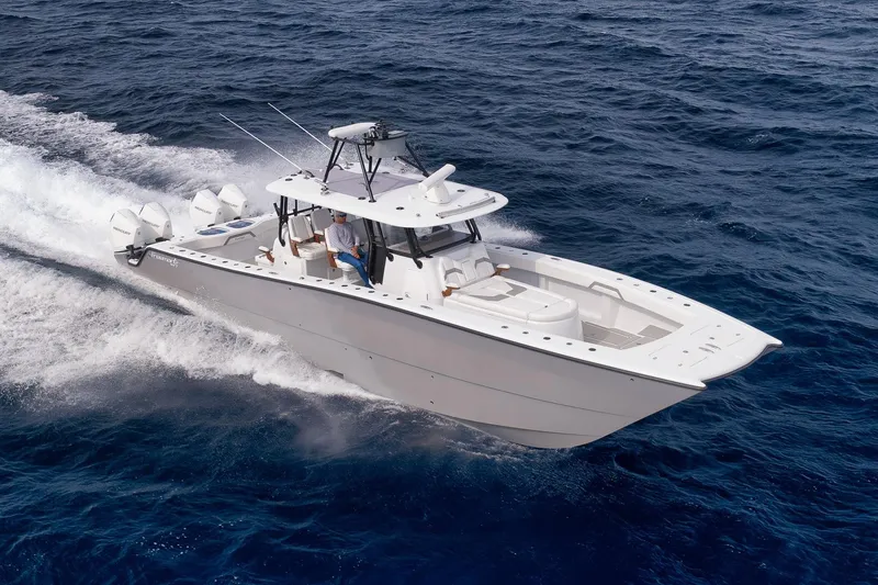 Slide: The Image of 2022 Freeman 42LR boat cruising on open ocean waters. - 13