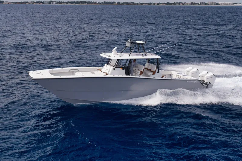 Slide: The Image of 2022 Freeman 42LR boat cruising on open ocean waters. - 19