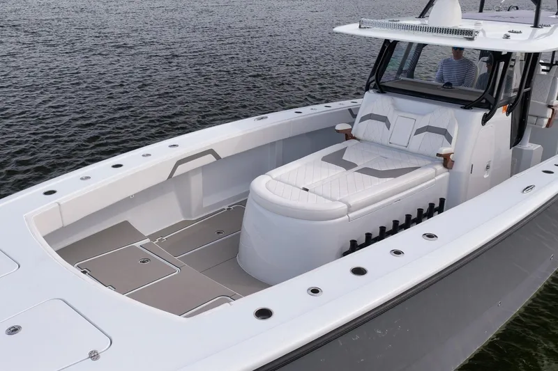 Slide: The Image of 2022 Freeman 42LR boat with spacious deck and luxurious seating on calm water. - 23