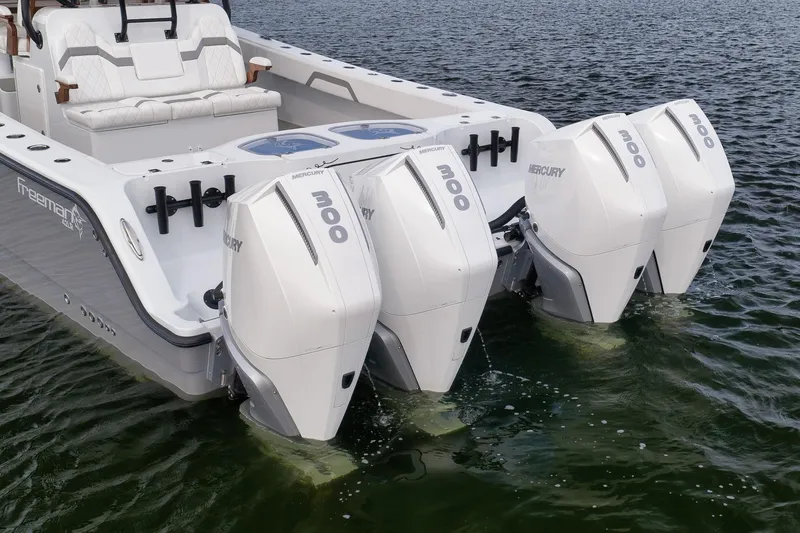 Slide: The Image of Freeman 42LR 2022 boat with four Mercury 300 outboard engines on water. - 26