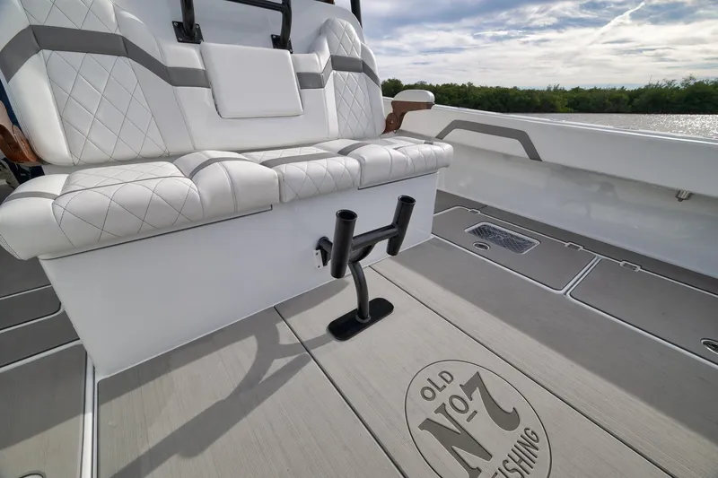 Slide: The Image of Luxurious seating on 2022 Freeman 42LR boat with custom flooring and rod holders. - 40
