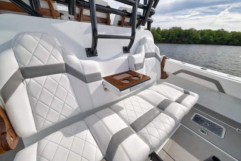 Slide: The Image of Luxurious seating on 2022 Freeman 42LR boat with quilted upholstery and cup holders. - 42