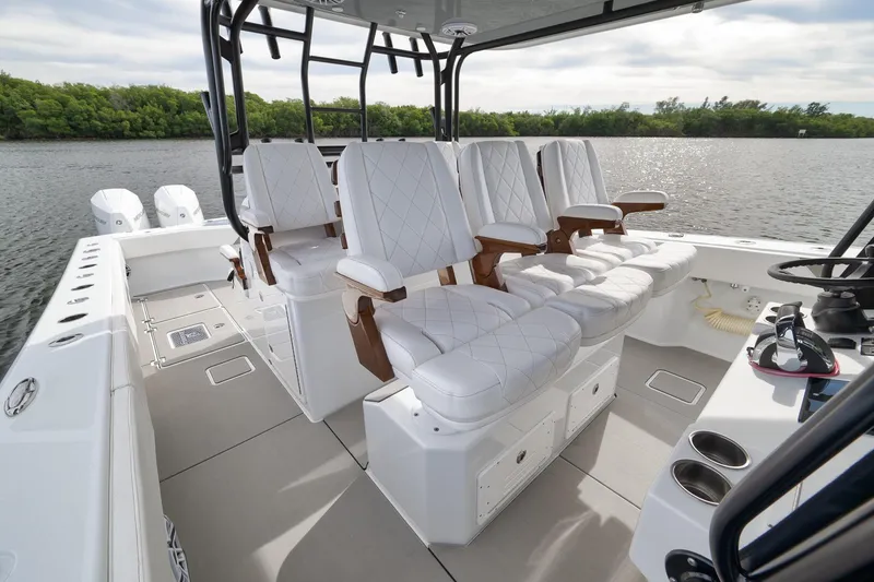 Slide: The Image of Luxurious 2022 Freeman 42LR boat interior with plush seating and scenic water view. - 43