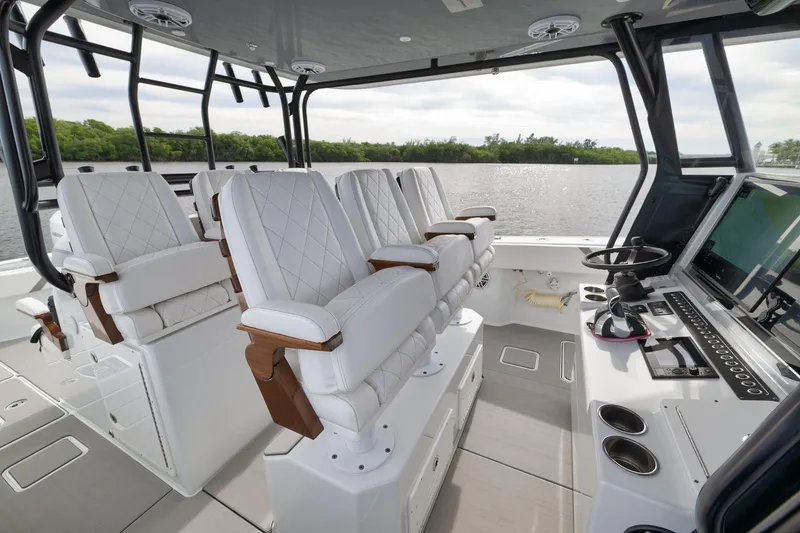 Slide: The Image of Interior of 2022 Freeman 42LR boat with luxurious seating and advanced navigation system. - 45
