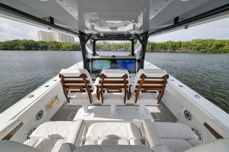Slide: The Image of 2022 Freeman 42LR boat interior with luxurious seating and advanced navigation system. - 49