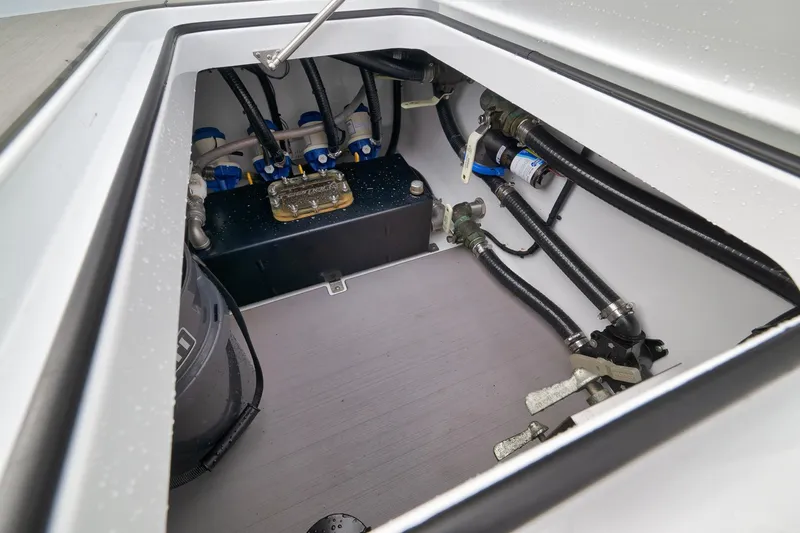 Slide: The Image of 2022 Freeman 42LR boat compartment with hoses and mechanical components. - 62