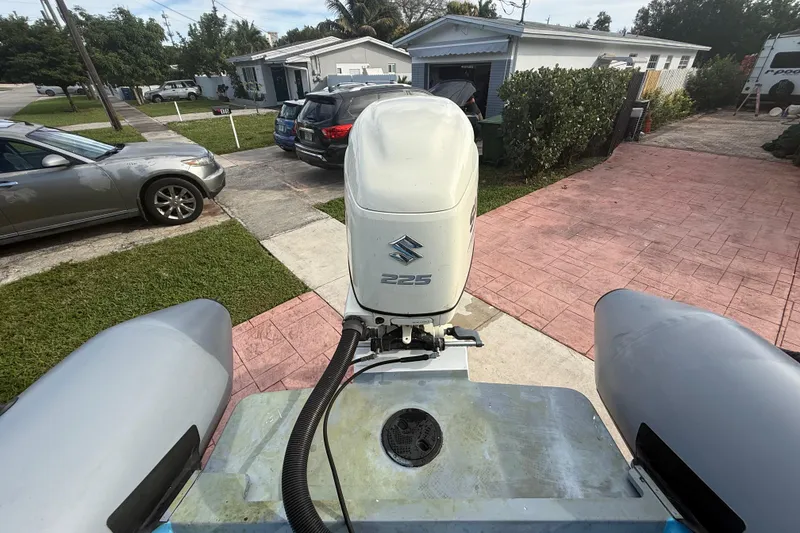 Slide: The Image of Novamarine SEVEN HD 1998 boat with Suzuki 225 engine in residential driveway. - 14