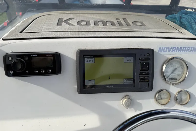 Slide: The Image of Control panel of a 1998 Novamarine SEVEN HD boat with navigation and audio systems. - 17