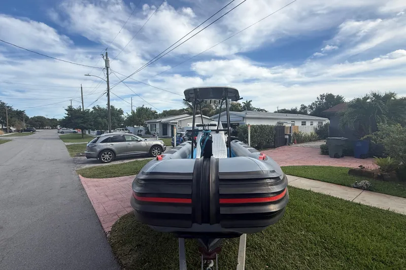 Slide: The Image of 1998 Novamarine SEVEN HD boat on trailer in suburban neighborhood. - 2