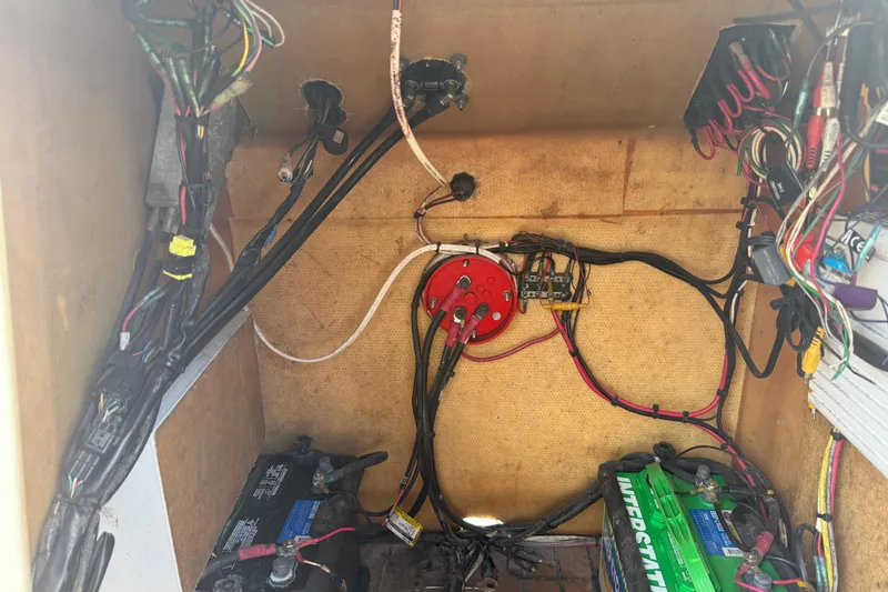 Slide: The Image of Electrical wiring and battery setup inside a 1998 Novamarine SEVEN HD boat. - 20