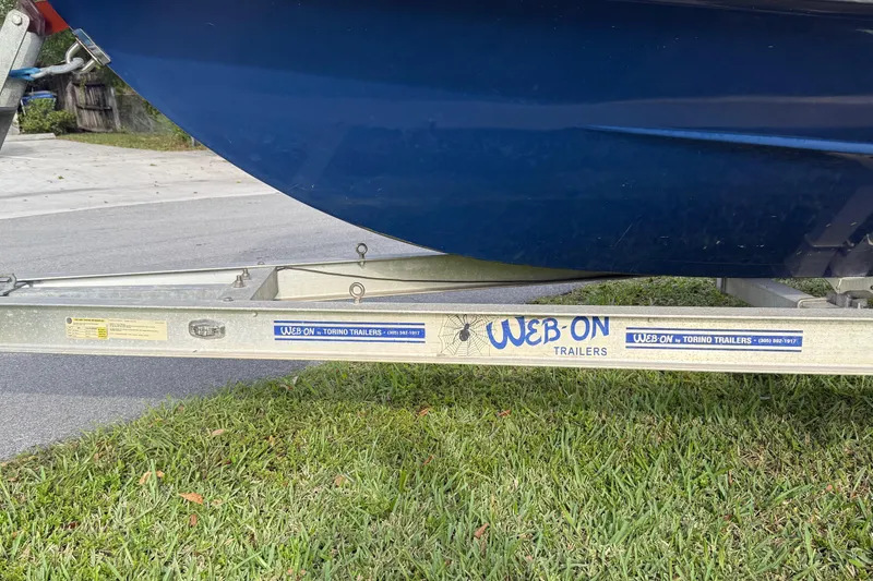 Slide: The Image of Trailer with Novamarine SEVEN HD 1998 boat, parked on grass. - 22