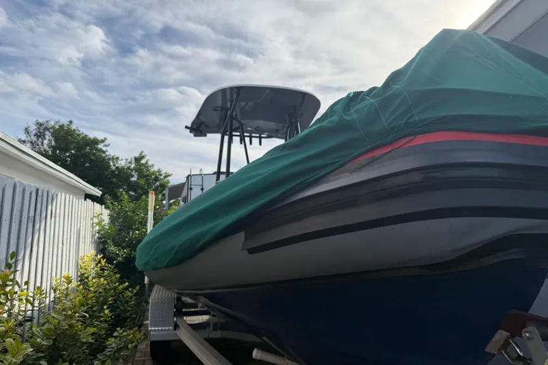 Slide: The Image of Covered 1998 Novamarine SEVEN HD boat on trailer under cloudy sky. - 24