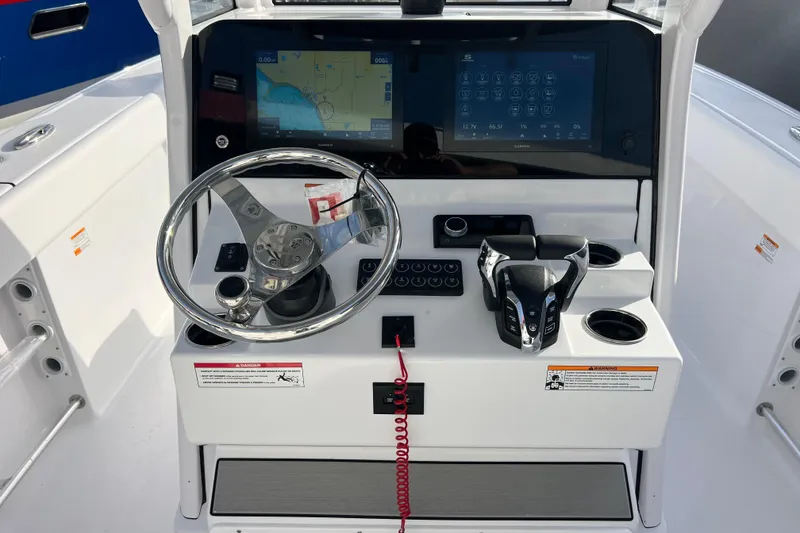 Slide: The Image of 2026 Sportsman Heritage 261 Center Console dashboard with steering wheel and navigation screens. - 12