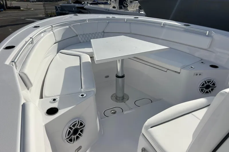 Slide: The Image of 2026 Sportsman Heritage 261 Center Console boat interior with seating and table. - 15