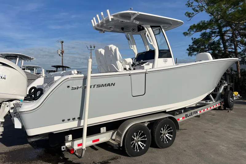 Slide: The Image of 2026 Sportsman Heritage 261 Center Console boat on trailer, side view. - 3