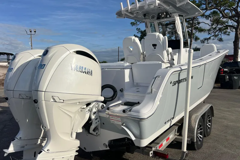 Slide: The Image of 2026 Sportsman Heritage 261 Center Console boat with Yamaha engines on a trailer. - 4