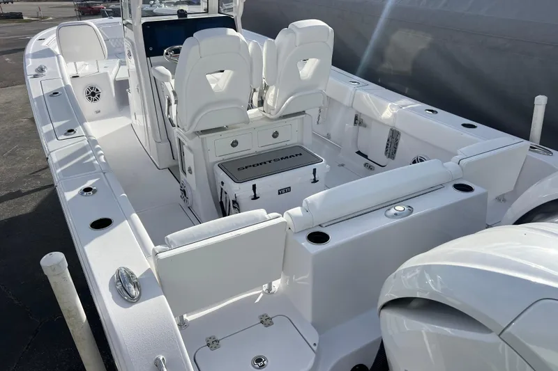 Slide: The Image of 2026 Sportsman Heritage 261 Center Console boat interior with seating and storage features. - 6