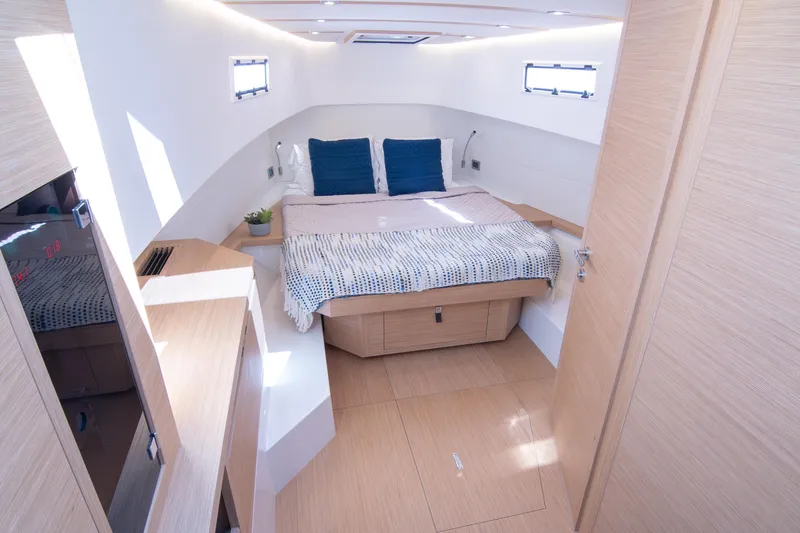 Slide: The Image of Luxury seating area on 2024 Pardo Yachts 38, featuring elegant wood table and waterfront view. - 22