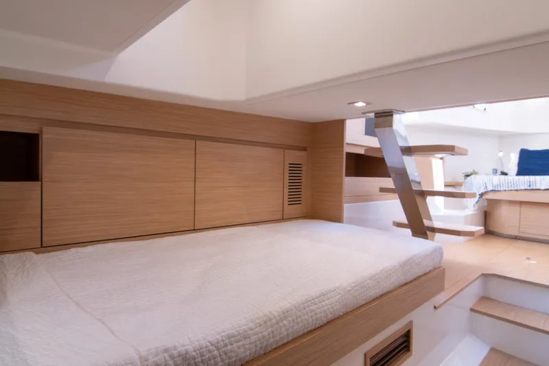 Slide: The Image of 2024 Pardo Yachts 38 cabin with twin beds and modern wooden interior design. - 26
