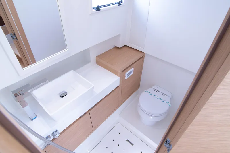 Slide: The Image of 2024 Pardo Yachts 38 interior cabin with modern wooden design and cozy bedding. - 27