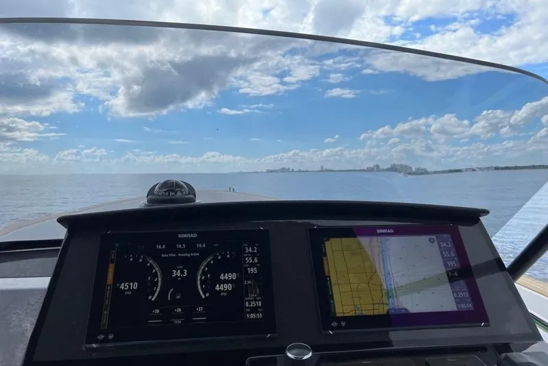 Slide: The Image of Cockpit view from 2024 Pardo Yachts 38, featuring navigation screens and open sea. - 38