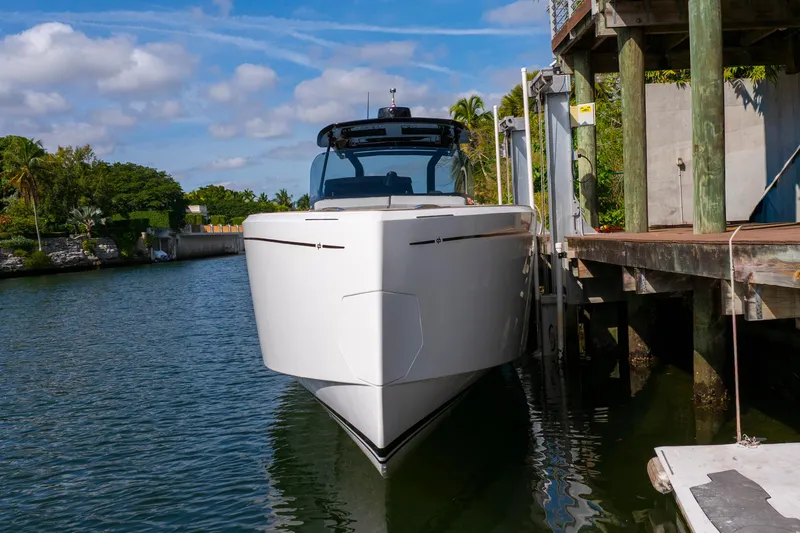 Slide: The Image of 2024 Pardo Yachts 38 docked in a serene waterfront setting. - 5