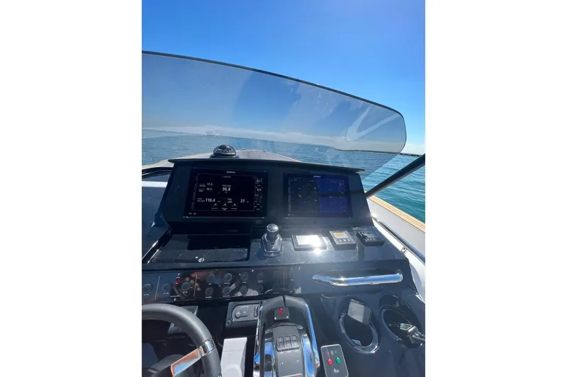 Slide: The Image of Cockpit view of 2024 Pardo Yachts 38, featuring modern navigation controls and ocean backdrop. - 35