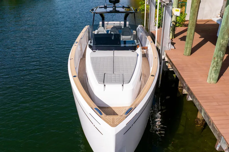 Slide: The Image of 2024 Pardo Yachts 38 docked, showcasing sleek design and spacious deck. - 4