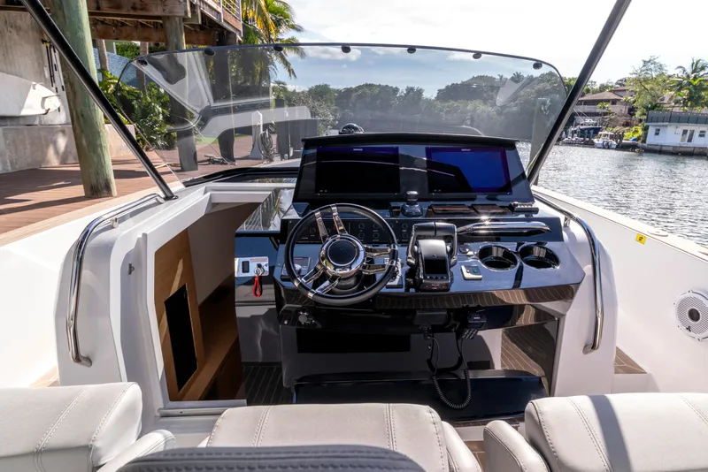 Slide: The Image of 2024 Pardo Yachts 38 on serene waterway, featuring sleek design and luxurious seating. - 8