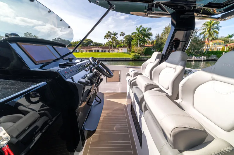 Slide: The Image of 2024 Pardo Yachts 38 helm with modern controls and waterfront view. - 9