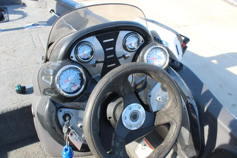 Slide: The Image of 2018 Tracker Pro Team 175 TF boat dashboard with steering wheel and gauges. - 10