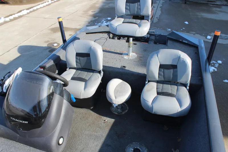 Slide: The Image of 2018 Tracker Pro Team 175 TF boat interior with seating and steering console. - 11