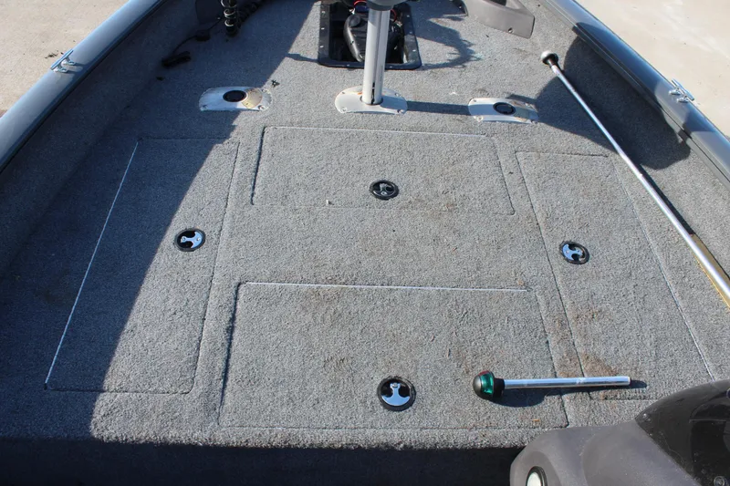 Slide: The Image of 2018 Tracker Pro Team 175 TF boat deck with storage compartments and fishing rod holder. - 13