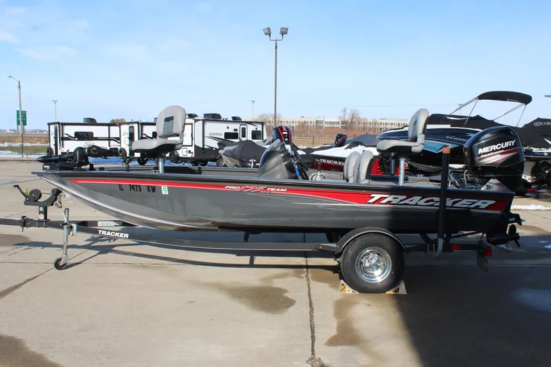 Slide: The Image of 2018 Tracker Pro Team 175 TF boat on trailer, parked outdoors. - 4