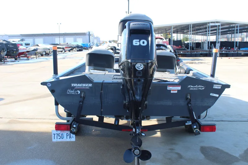 Slide: The Image of 2018 Tracker Pro Team 175 TF boat with Mercury 60 engine, parked in marina. - 6