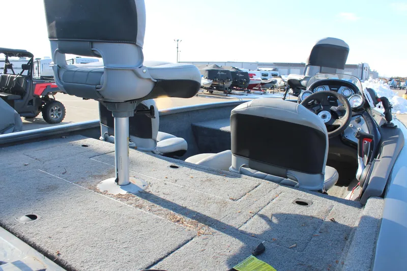 Slide: The Image of 2018 Tracker Pro Team 175 TF boat interior with seating and steering console. - 8