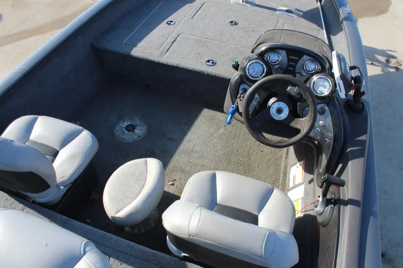 Slide: The Image of 2018 Tracker Pro Team 175 TF boat interior with steering console and seating. - 9