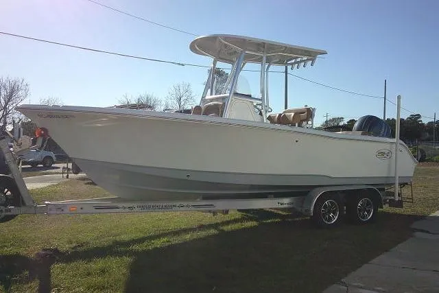 Slide: The Image of 2023 Sea Hunt Ultra 234 boat on trailer, side view, outdoors. - 11