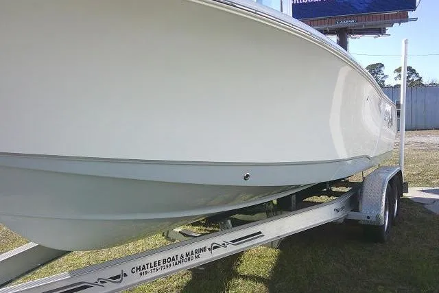 Slide: The Image of 2023 Sea Hunt Ultra 234 boat on trailer, side view, outdoors. - 12